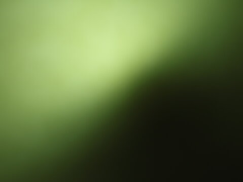 Una toma de cerca de un fondo abstracto de   color verde con negro con un degradado ligero desenfocado