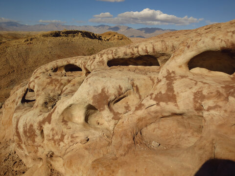 Small Cave Rock Formations with Desert View