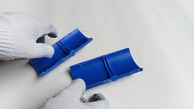 HDPE Welding Sequence: Close Up of Cut Fusion Joint Pieces on White Background Showing Seamless Weld