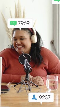Vertical video: Host streaming into mic using laptop, live likes causing follower hearts