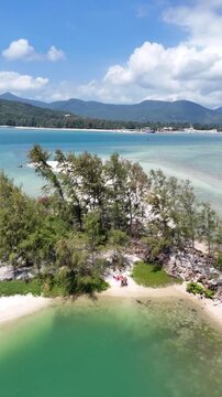 Vertical Aerial View of Koh Tae Nai Lagoon with Turquoise Water and Koh Phangan Horizon Thailand