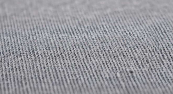 Textured textile detail, showcasing a close-up of woven fabric with a captivating array of parallel lines, demonstrating its intricate pattern and tactile nature.
