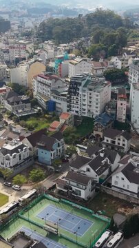 Vertical screen, Vietnam, Da Lat Aerial View Dalat Compact Neighborhood Rooftops Travel Photographer Perspective Capturing Colorful Rooftops, Narrow Alleys, Local Shops, Parked Scooters,