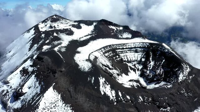 Aerial view of the active Tungurahua volcano in the Andes of Ecuador, nature or mountain background of a in snow covered summit