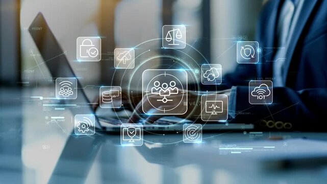 Businessman in modern office working on laptop with audience targeting icon surrounded by cloud, protection and connectivity symbols, illustrating smart business technology and analytics