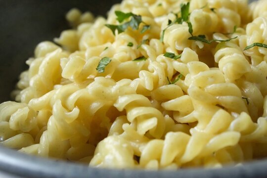 close up of fusilli pasta in a bowl