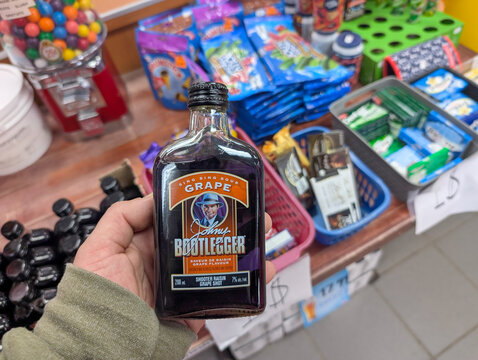 Canada, 29 March 2026 : Johns Bootlegger Sing Sing Sour Grape bottle held in a retail store setting