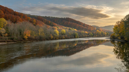 Naklejka premium Autumn River Landscape Golden Hour Scenic Hills