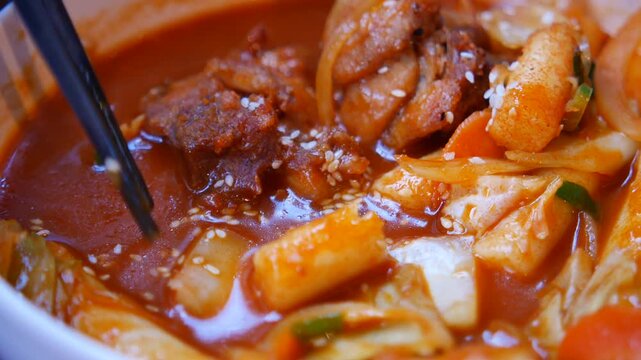 Close-up of Spicy Korean Tteokbokki with Chicken and Rice Cakes
