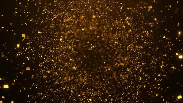 Golden glitter particles sparkling on black background with ample copy space
