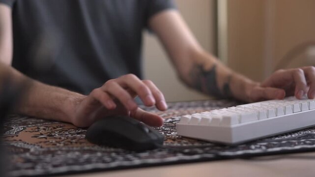 Closeup Of Hands Typing On White Keyboard With Tattooed Forearm Illuminated By Gentle Window Light. Media