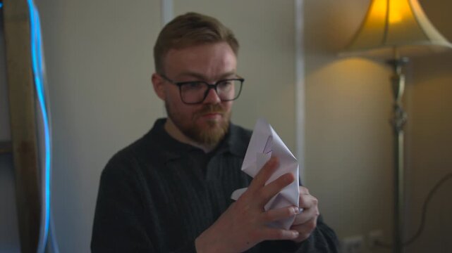 Individual Cleans Workspace After Review. Someone Disposes Of Paper Into Recycling Container Swiftly. Media