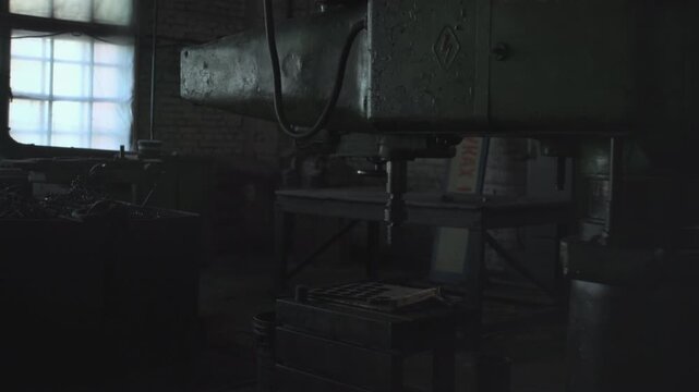 Industrial Setting With Tools. Quiet Repair Area With Suspended Power Cords And Worn Metal Surfaces. Media