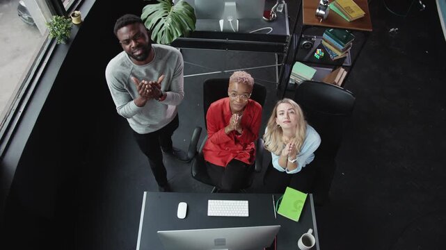 A diverse team of professionals is collaborating effectively within a modern office environment