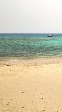 People enjoying a sunny day at Caleta del Congrio beach in Lanzarote