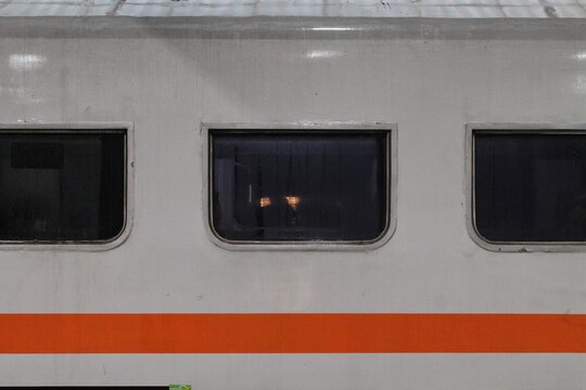 Train Windows And Orange Stripe On Retro Passenger Carriage