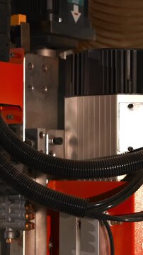 Detailed Machinery Setup, Focused Image Of Spindle Components With Cables And Vacuum Tubing Attached . Media