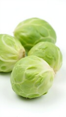 Fototapeta premium Vibrant green Brussels sprouts on white plate.
