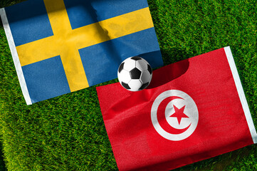 Fototapeta premium Sweden vs Tunisia, national flags before world championship Group F group stage match, football on green pitch with goal in the background, Guadalupe, Mexico, June 14, 2026