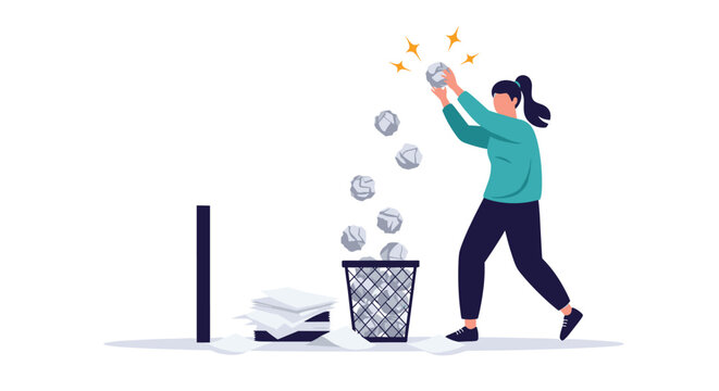 Woman throwing crumpled paper into a trash bin while clearing her office desk of various old documents and files.