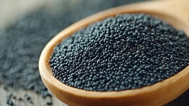 selective focus poppy seeds in wooden spoon close up