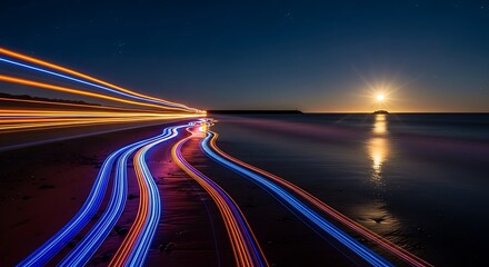 Obraz premium Stunning long exposure light trails along a dark coastal road at twilight.