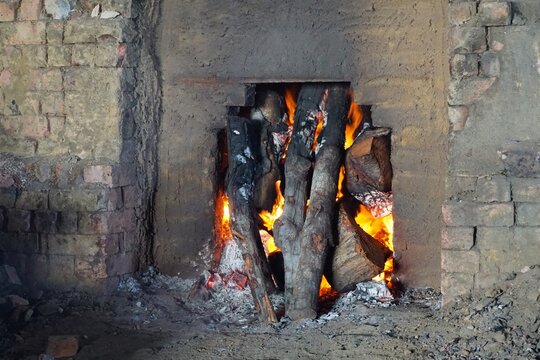 Charcoal Kiln With Burning Wood