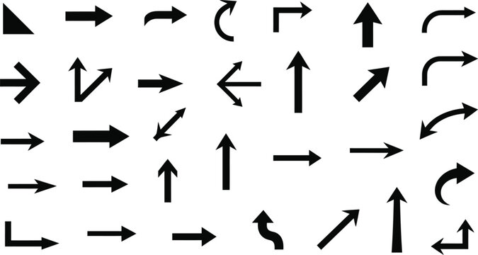Collection of various black arrows on plain surface for navigation and direction