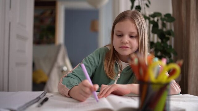 Caucasian girl writing homework at table, intent expression with colored pencils nearby, braided hair, notebook open, cozy interior, lamp glow creating warm .