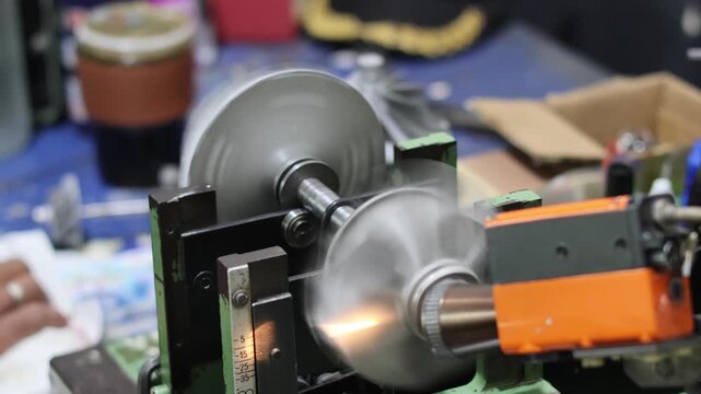 Professional balancing machine technician calibrating a high-speed turbocharger turbine wheel to ensure precision performance and reduce vibration in automotive engineering workshop.