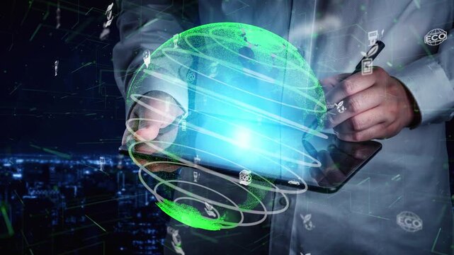 A close-up of hands using a digital tablet display over a glowing green globe with various eco and tech icons, set against a modern cityscape at night showcasing innovation. Xenic