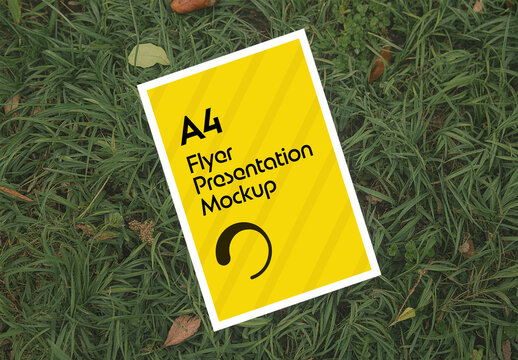 Realistic A4 Flyer Mockup on Green Grass