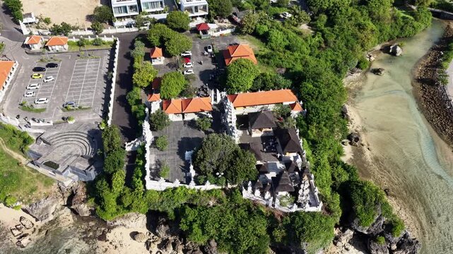 Aerial View of Pura Geger Dalem Pemutih Temple on a Rock Cliff by the Ocean in Bali