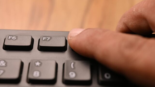 Pressing F8 Key on Keyboard for System Boot Option Selection on Computer