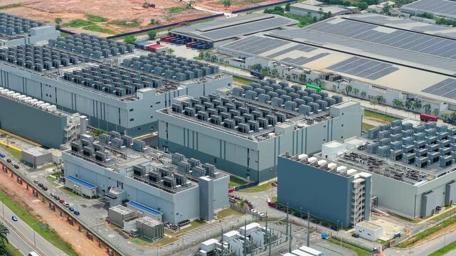 Low Aerial Tracking Shot of Hyperscale Data Center Rooftop Cooling Tower Arrays, Sedenak Tech Park Malaysia