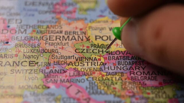 Close-Up World Map Shot Featuring Green Pin Highlighting Czechia Pointed by Hand 4K 60fps