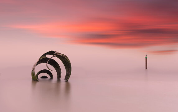 Marys Shell Blackpool Long Exposure Sunset. Colourful Sky and Calm Seascape create Serene Coastal Landscape in England UK.