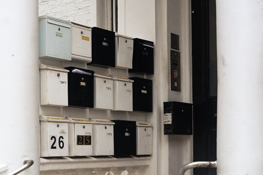 Cluster of residential mailboxes in apartment entrance