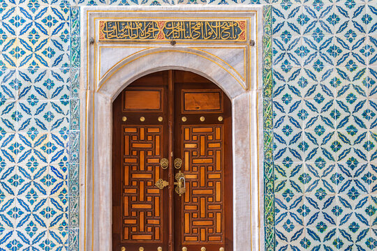 Ancient hand made Turkish - Ottoman tiles and door in Topkapi Palace. Turkey, Istanbul.