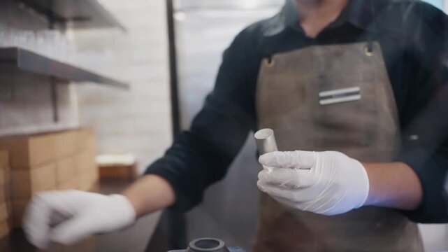 Professional jeweler weighing metal on digital scale