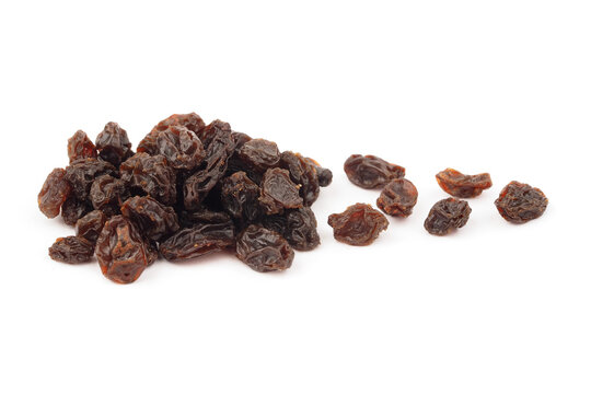 Heap of black raisins isolated on white background.