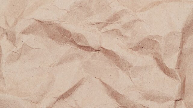 Stop motion of crumpled craft brown paper texture, abstract loop background