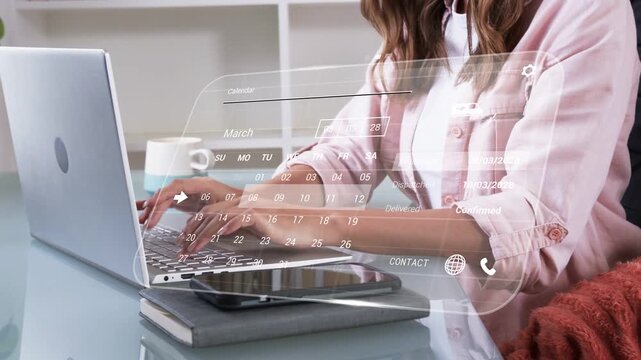 Mid-adult woman typing on laptop, HUD appearing at start and showing calendar for business planning