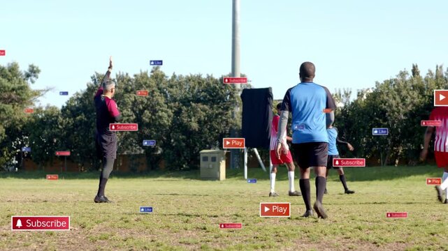 Referee raising hand, signaling, players regrouping after call on sports pitch with Subscribe Play