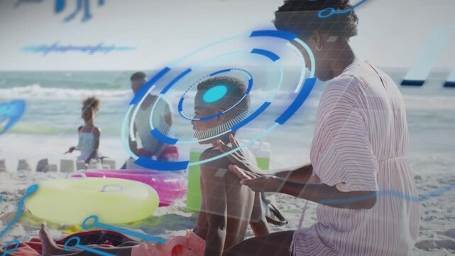 Mid adult woman applying SPF rubbing boy's back and activating HUD rotating over head for health