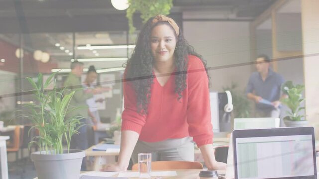 Woman leaning on desk as coworkers consulting papers, reviewing laptop data for business