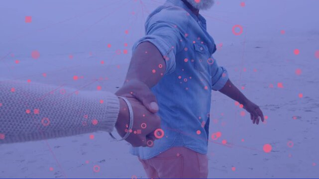 POV reaching man clasping hand leading mate forward along foggy shore pink dots overlaying for ads