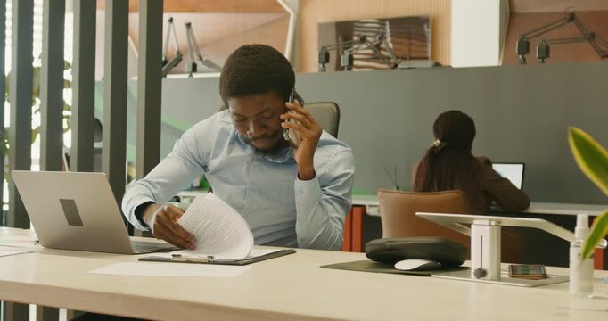 Concentrated individual working in open office environment