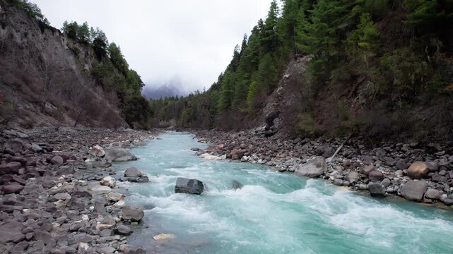 Close up view of Parlung Zangbo river along G318 or China National Highway 318 between Bomi and Baxoi County, Tibet, China, beautiful turquoise water in valley, 4k real time footage travel concept.