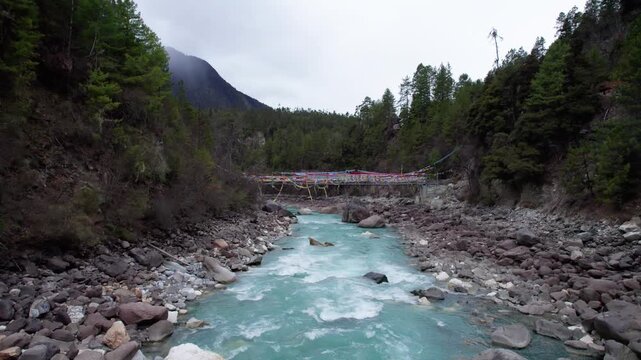 Drone view Parlung Zangbo river running along G318 or China National Highway 318 between Bomi and Baxoi County, Tibet, China, beautiful turquoise water in valley, 4k real time footage travel concept.